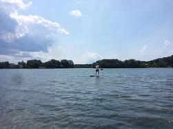 My friend demonstrates the use of the paddleboard.